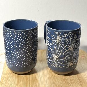 aurie Gates Madrina Mugs 19 Ounce Stoneware Two Blue Cups with White Designs